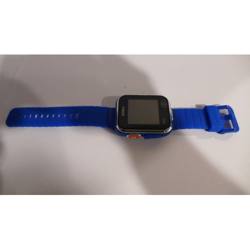 3100 - A blue V-Tech Smart watch (DX2) with charging lead