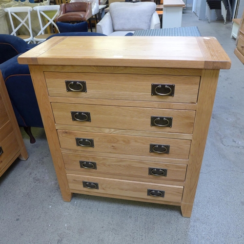 1387 - An oak chest of five drawers