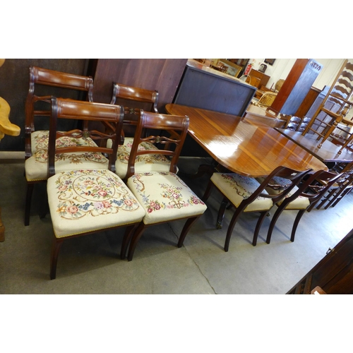 195 - A Regency style inlaid mahogany extending pedestal table