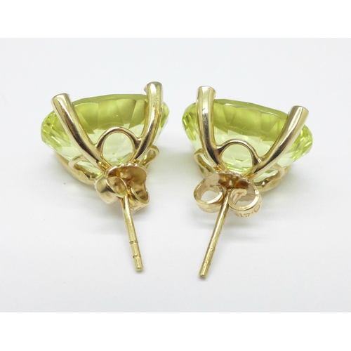 1008 - A pair of large 9ct gold and citrine ear studs