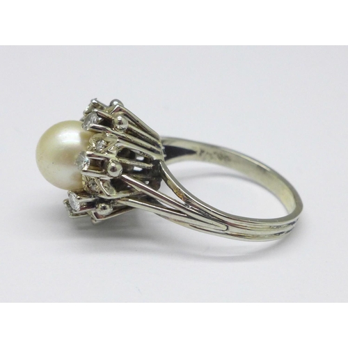 1015 - A diamond and pearl set cocktail ring, marks to outside of shank, 6.5g,  N