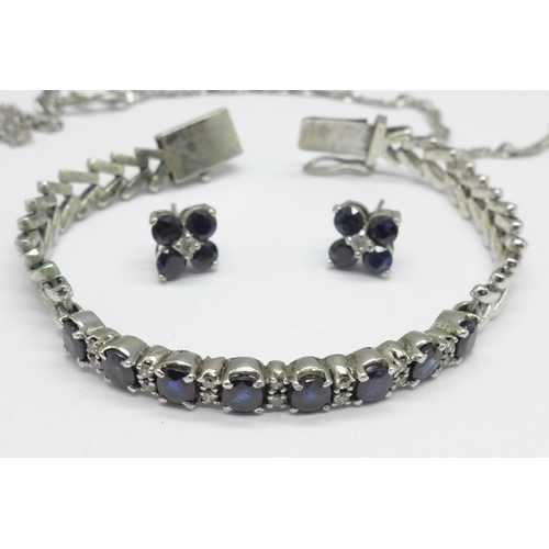 1066 - A diamond and sapphire set bracelet and pendant, and a pair of earrings set with blue and white ston... 