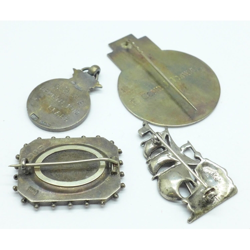 1067 - A Victorian silver brooch, a silver fob, etc.