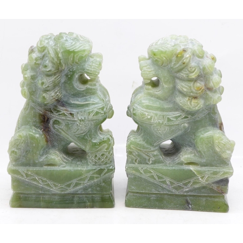 630 - Two carved jade dogs of foe, 12cm