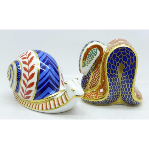 632 - Two Royal Crown Derby paperweights, Snake and Snail, Snake with gold stopper