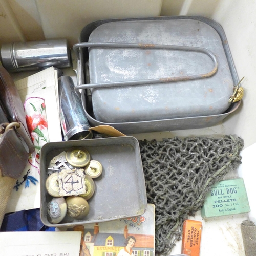 712 - Military items; three swagger sticks, a Sam Browne, two mess tins, badges, medals and buttons includ... 