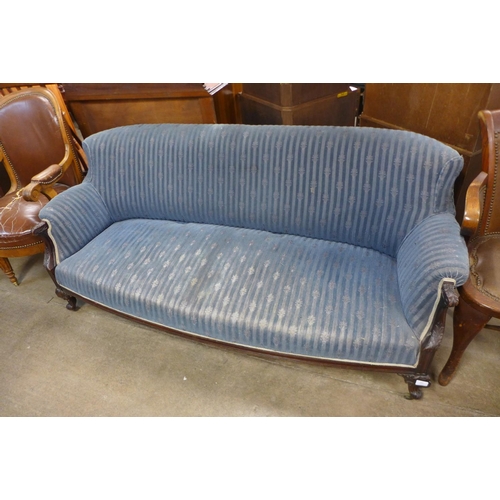 220 - A Victorian carved mahogany and upholstered settee