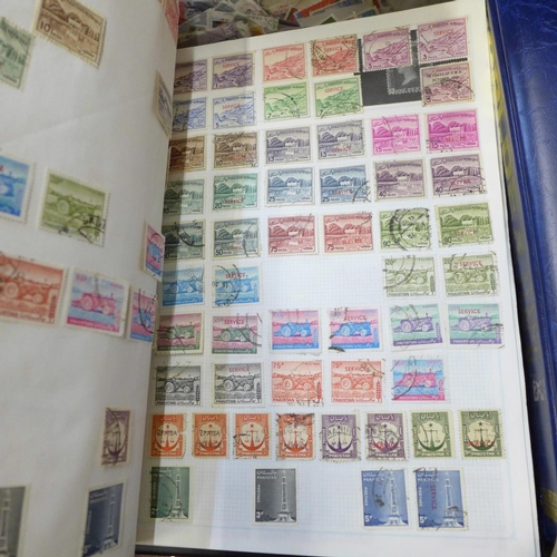 726 - A box of worldwide stamps in four albums and loose albums, etc.