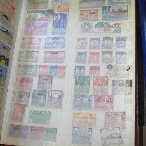 726 - A box of worldwide stamps in four albums and loose albums, etc.