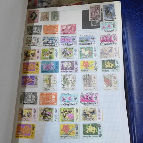 726 - A box of worldwide stamps in four albums and loose albums, etc.