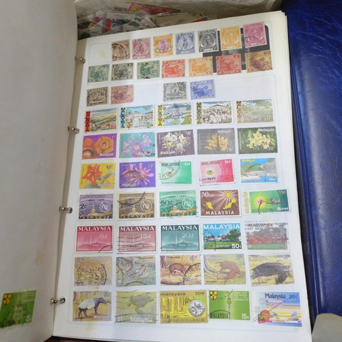 726 - A box of worldwide stamps in four albums and loose albums, etc.