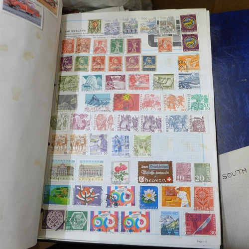 726 - A box of worldwide stamps in four albums and loose albums, etc.