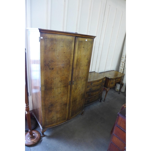 236 - A Queen Anne style walnut bow-fronted three piece bedroom suite