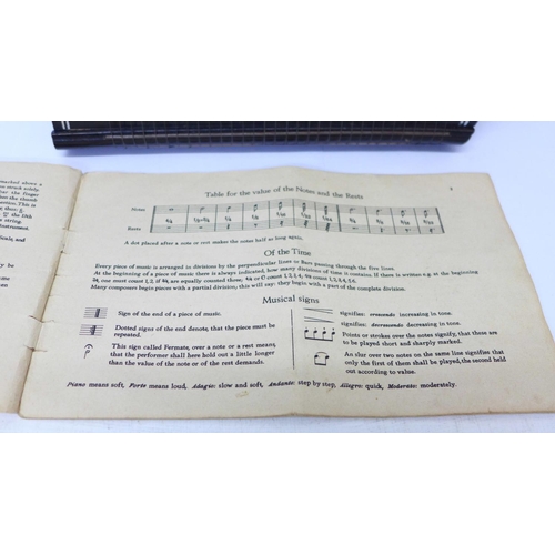 789 - An autoharp with tuner and instruction booklet