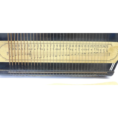 789 - An autoharp with tuner and instruction booklet