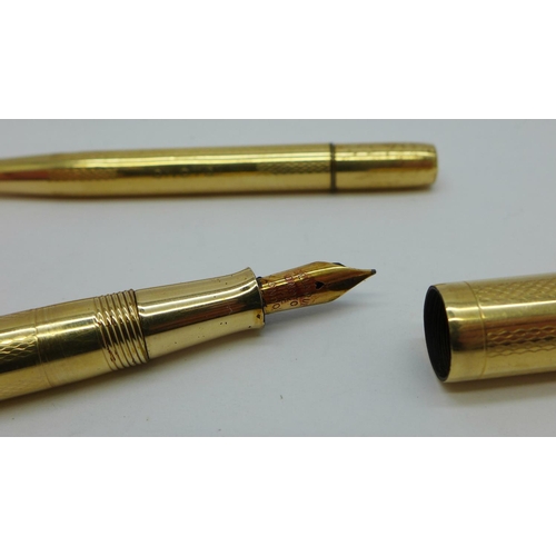 844 - A gold plated Onoto pen with 14ct gold nib and a matching pencil