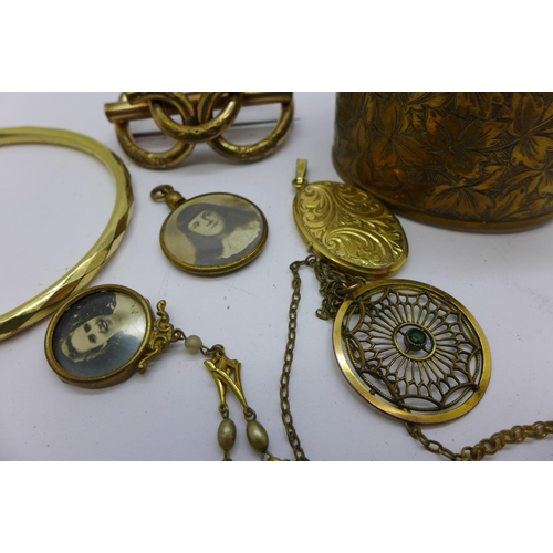 851 - A Victorian brooch, two bangles, etc.