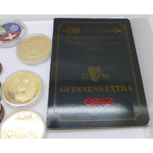 864 - Mixed foreign coins, four commemorative coins and a Guinness coin