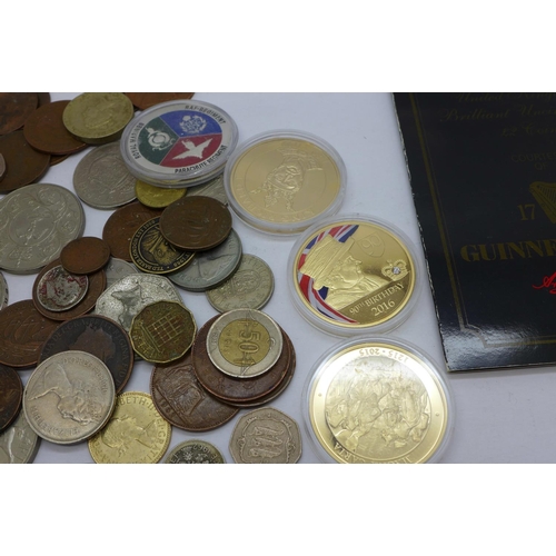 864 - Mixed foreign coins, four commemorative coins and a Guinness coin