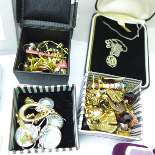 881 - A large collection of earrings, some silver, rings, necklaces, etc.