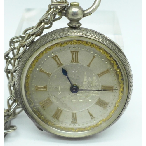 915 - A silver fob watch with engraved landscape on dial, fitted case