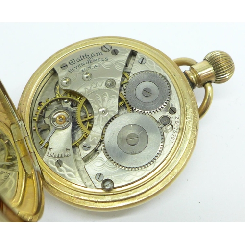 928 - A Waltham gold plated half-hunter pocket watch