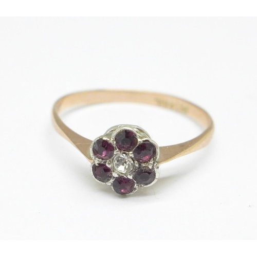 945 - A 9ct gold, silver, purple and white stone ring, L