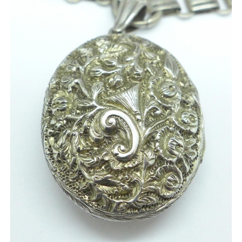 947 - A silver locket and a collarette, the locket marked sterling silver