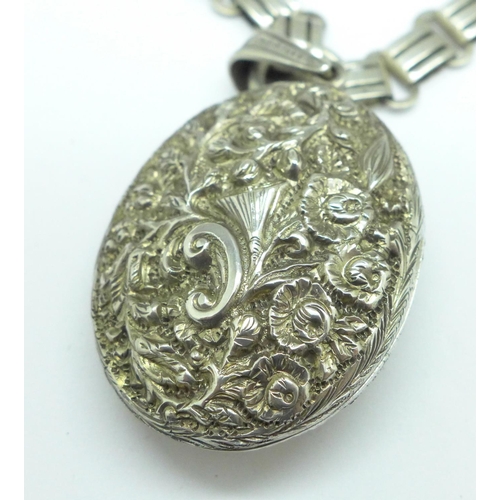 947 - A silver locket and a collarette, the locket marked sterling silver