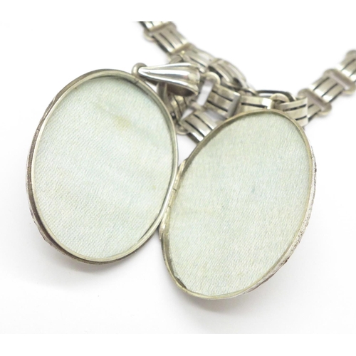 947 - A silver locket and a collarette, the locket marked sterling silver