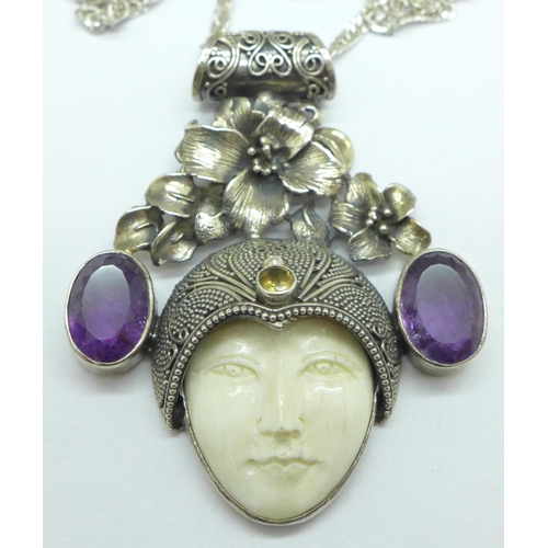 996 - An Art Nouveau style silver pendant and chain set with amethyst