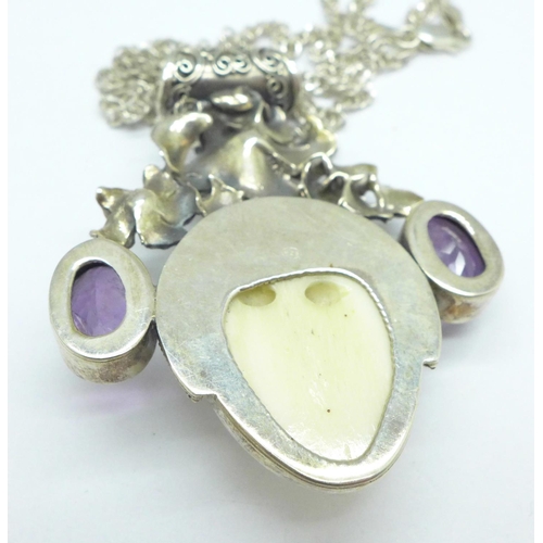 996 - An Art Nouveau style silver pendant and chain set with amethyst