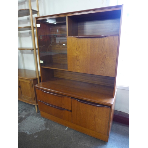 156 - A teak display cabinet