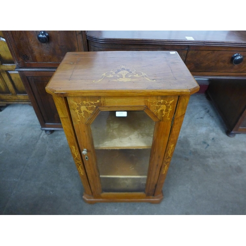 174 - An Edward VII inlaid walnut cabinet