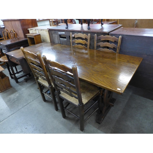 185 - An oak refectory table and four chairs