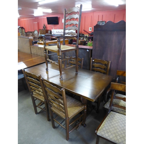 196 - An oak refectory table and five chairs