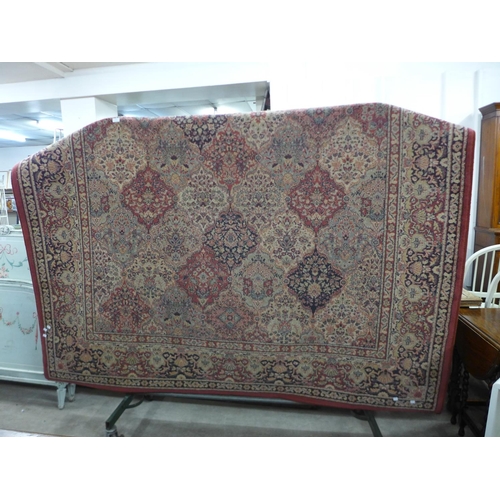 247 - A large red ground rug