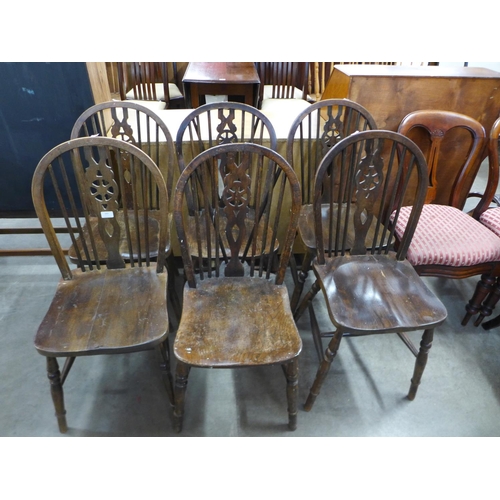 263 - A set of six elm wheelback chairs