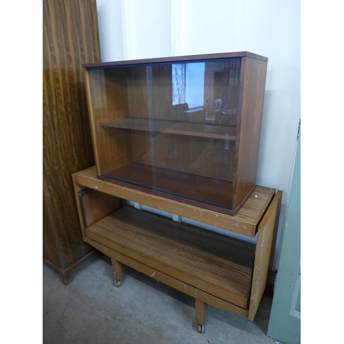 267 - A Lloyd Loom chair and four cane chairs and a teak wall mounted unit, a serving trolley and a wardro... 