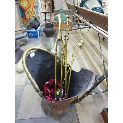 293 - A Victorian copper and brass coal scuttle and a brass companion set