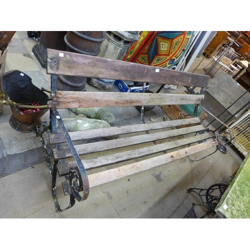 296 - A Victorian wrought iron and slatted garden bench