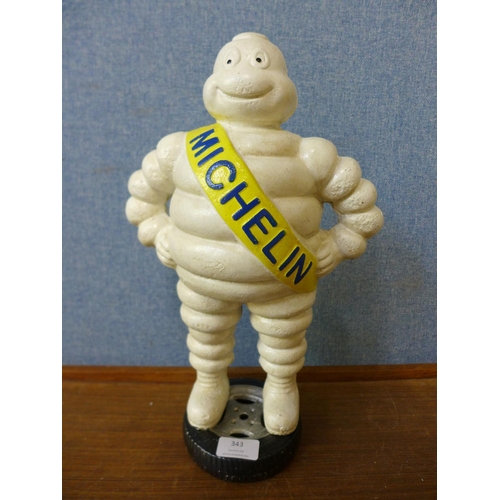 343 - A reproduction cast iron Michelin Man figure