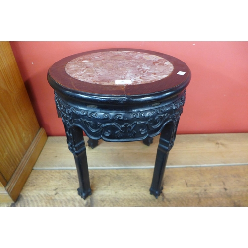90 - A 19th Century Chinese carved rosewood and marble topped jardiniere stand