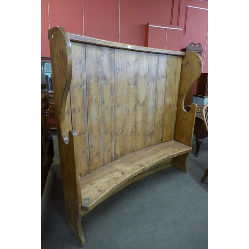 106 - A 19th Century style pine bacon settle
