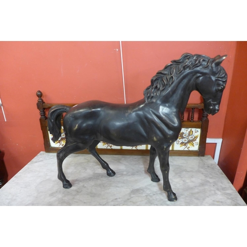 117 - A large bronze figure of a stallion