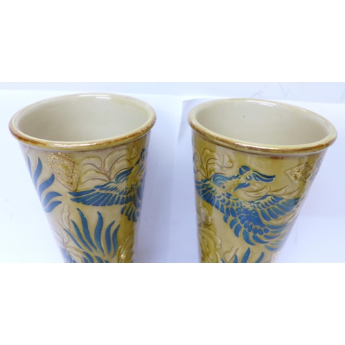 608 - A pair of Doulton Lambeth Art Nouveau vases, circa 1890-1900, decorated with phoenix in foliage, A. ... 