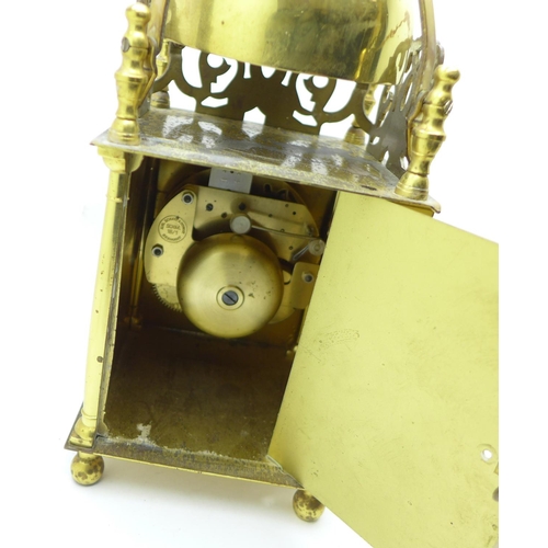 673 - A brass lantern clock with Shatz of Germany movement