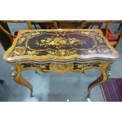 101 - A 19th Century rosewood, marquetry inlaid and ormolu mounted fold-over card table