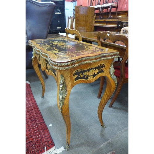 101 - A 19th Century rosewood, marquetry inlaid and ormolu mounted fold-over card table