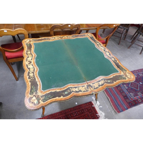 101 - A 19th Century rosewood, marquetry inlaid and ormolu mounted fold-over card table